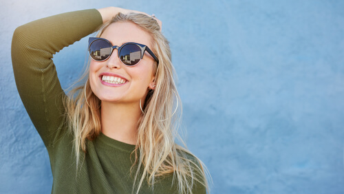 close up shot of stylish young woman in sunglasses smiling-img-blog