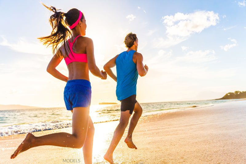 Couple running on the beach