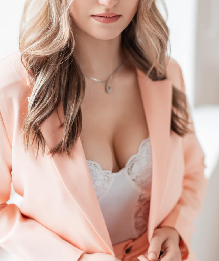 Woman in a suit showing cleavage