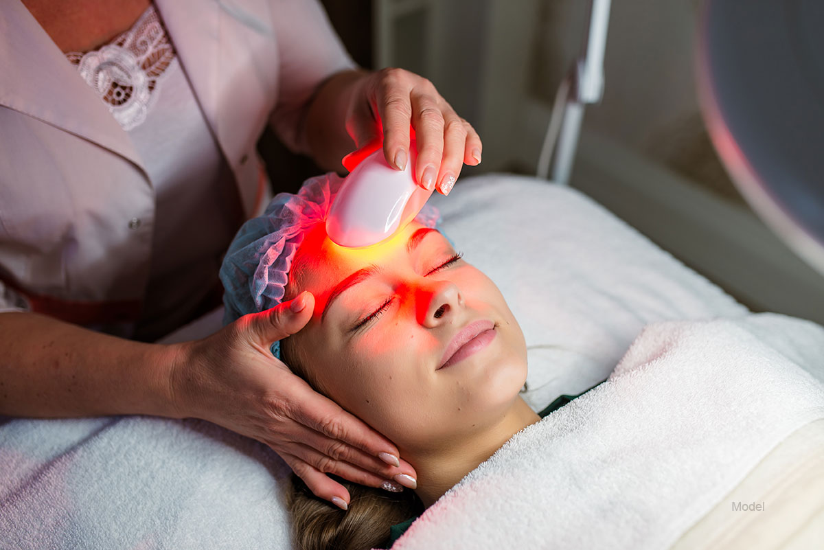 Young Woman Receiving Facial Beauty Treatment, Removing Pigmentation