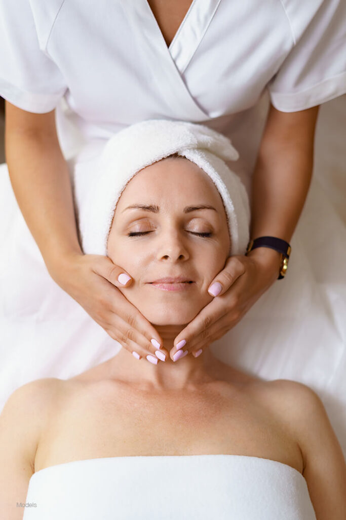 Woman getting a facial massage 
