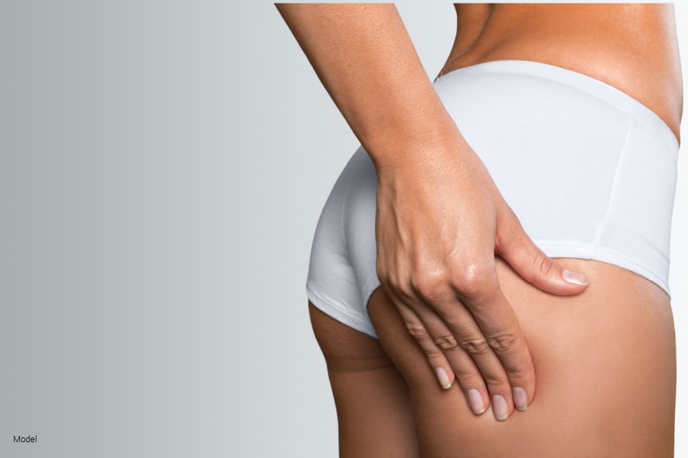 woman in underwear squeezing her butt