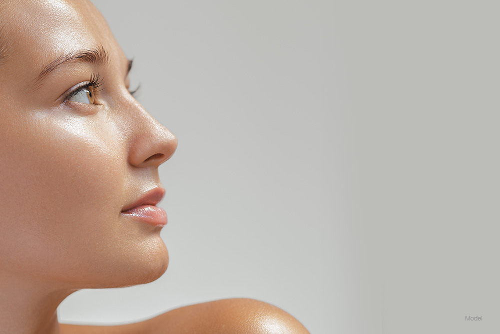 Profile of a young woman with glowing skin